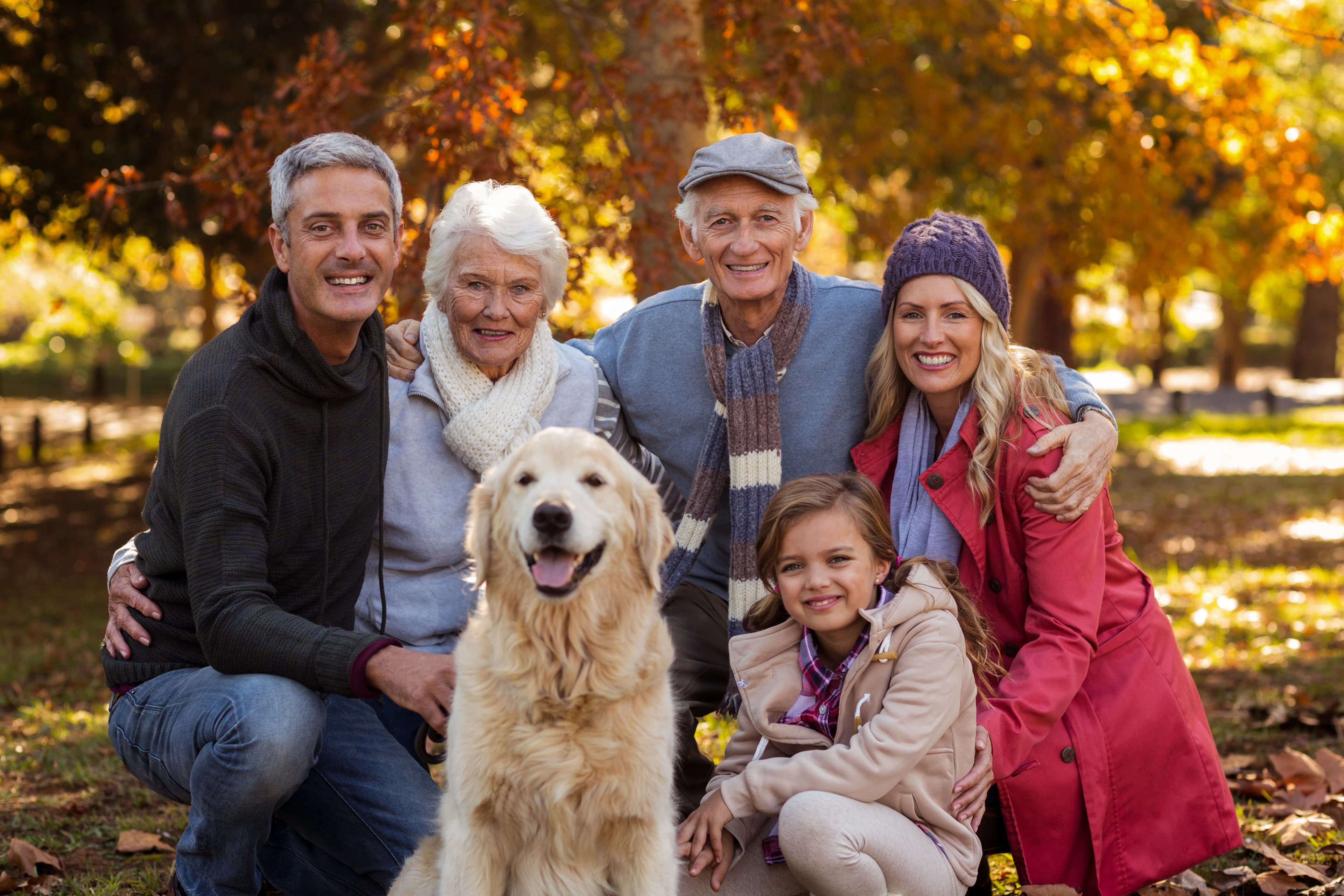 Family sharing a warm moment together with their dog